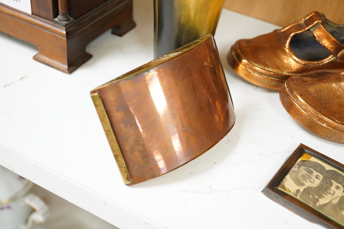 A collection of mixed metalware to include a copper plaque and brass ink blotter, together with a horn beaker